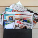 Junk mail overflowing from mail box