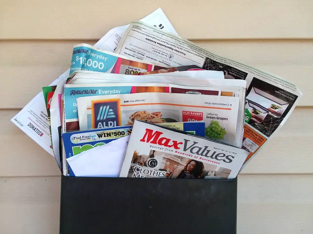 Junk mail overflowing from mail box