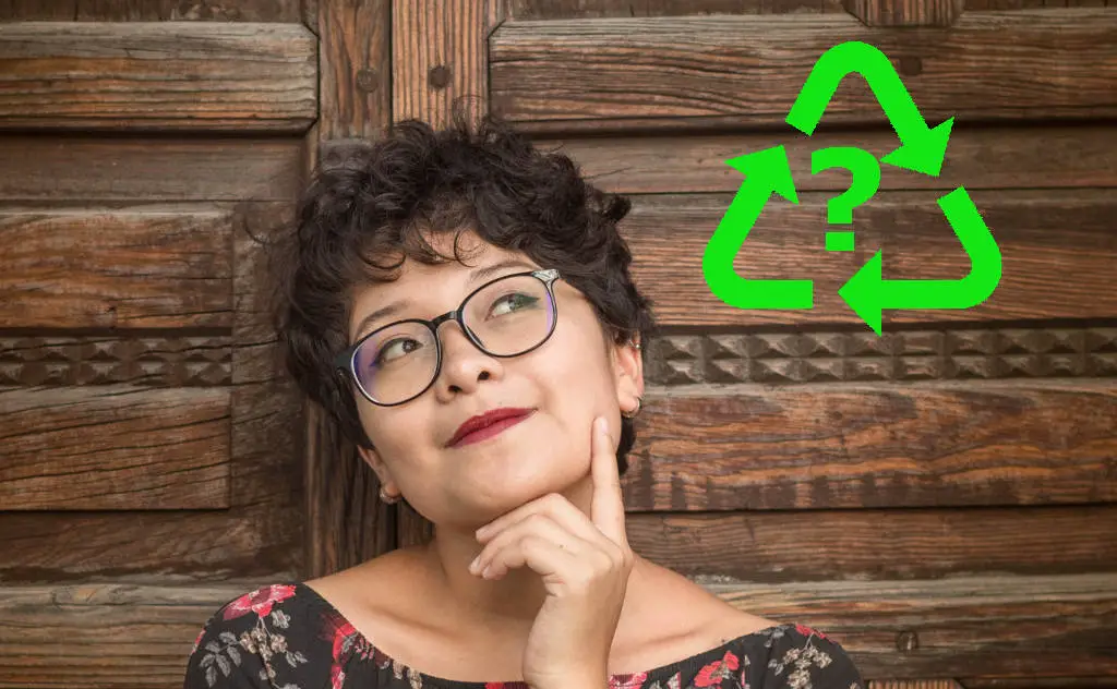 Woman thinking about recycling
