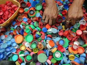 How do I recycle plastic bottle caps?