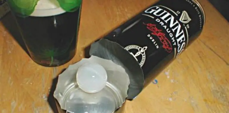 Can of Guinness cut open with plastic widget inside.